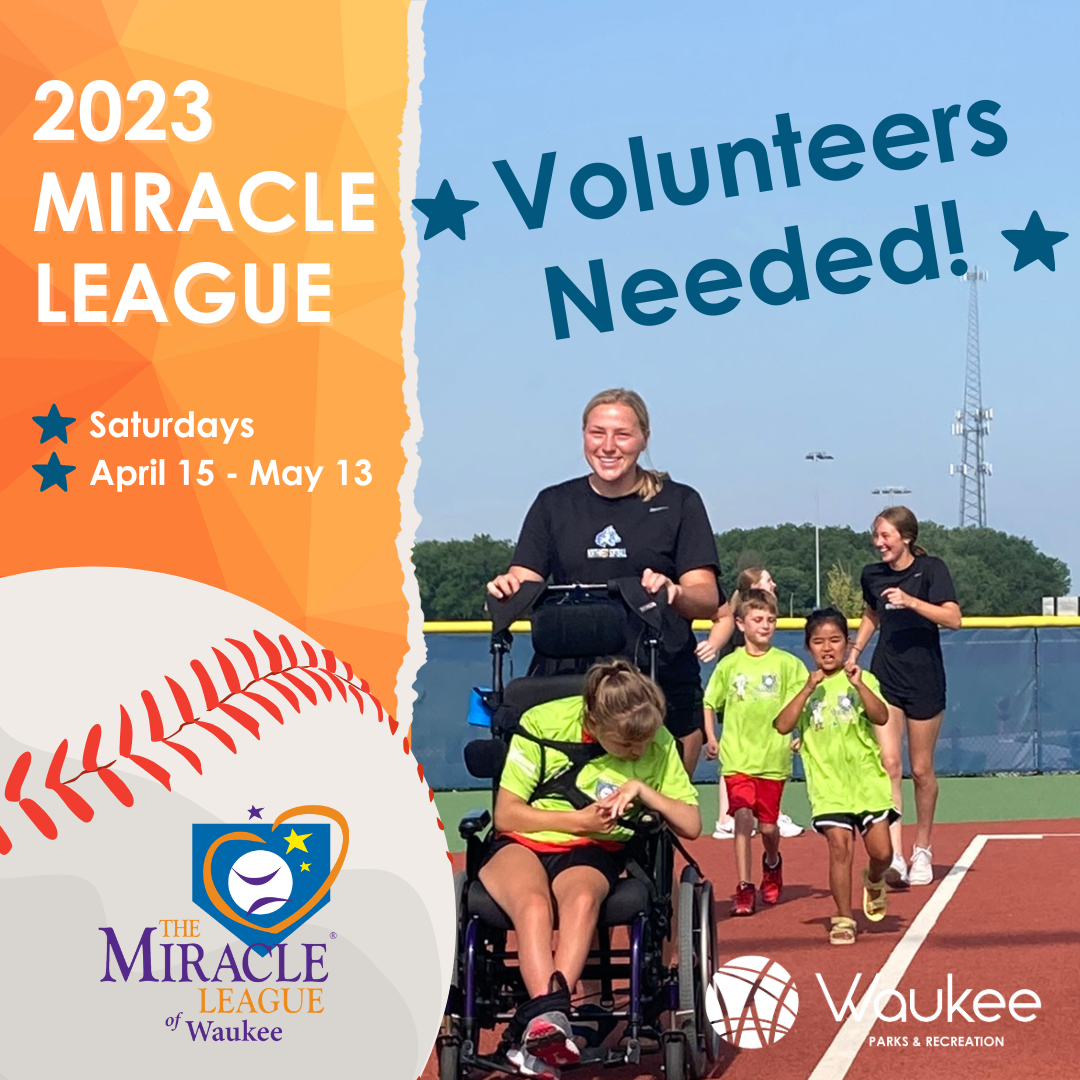 teenage girl pushing younger girl in a wheelchair on a baseball field