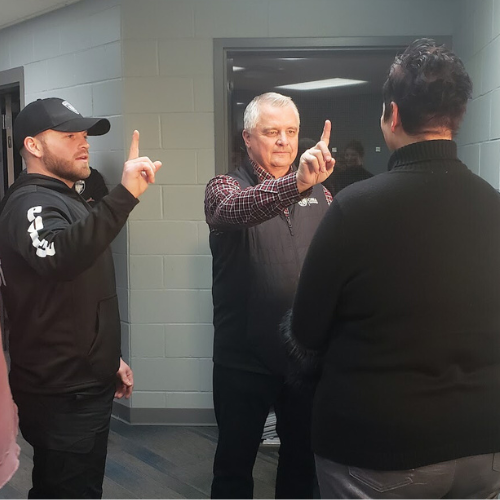 An officer and resident practicing performing a field sobriety test during Citizens Academy.